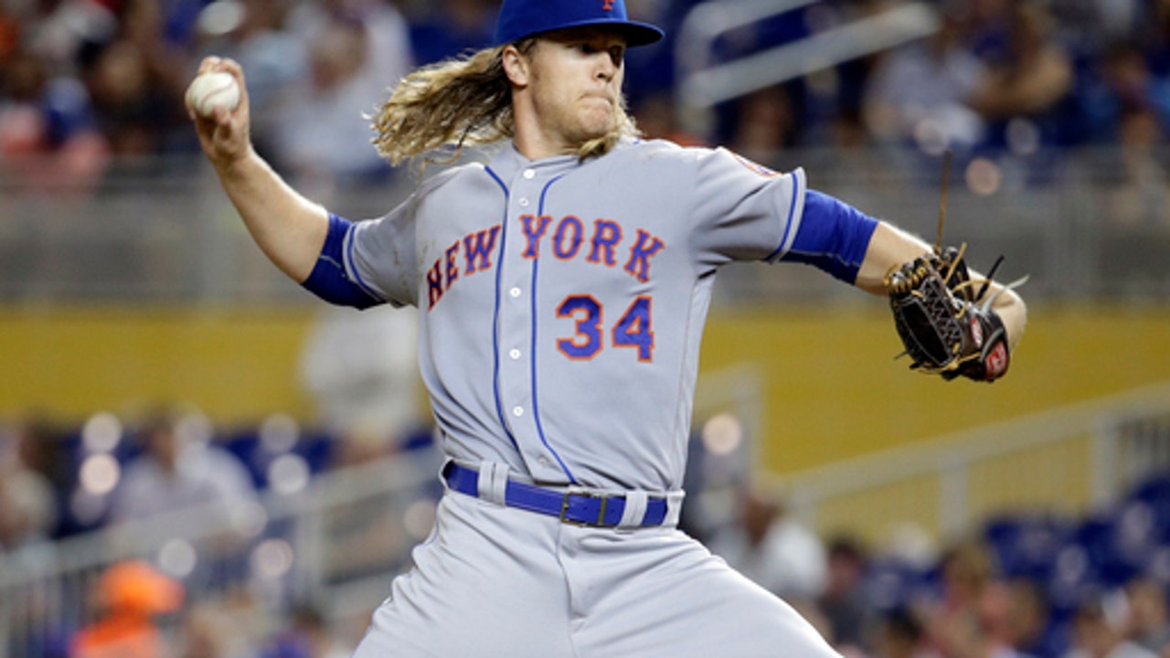 Mets help playoff chances by beating mourning Marlins 12-1